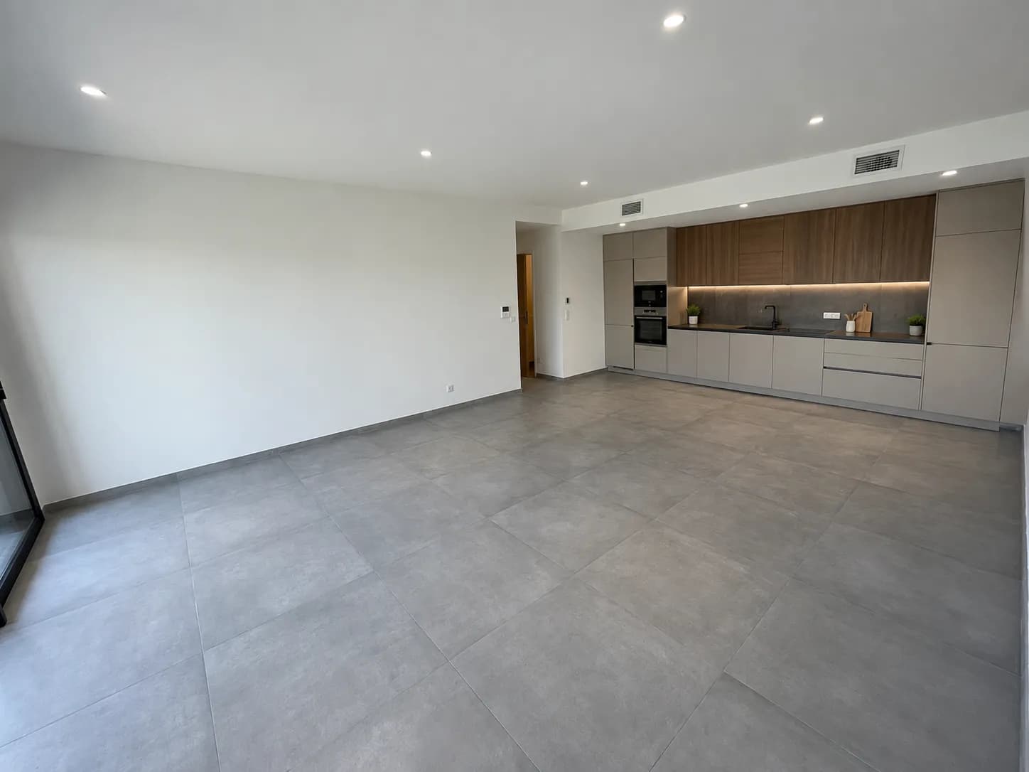 Vue d'artiste de la cuisine équipée incluse dans l'appartement 002
